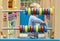 Little boy playing with an abacus