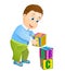 Little boy playing with abc alphabet cubes