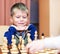 Little boy playing chess