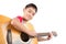 Little boy playing classic guitar course on white background