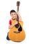 Little boy playing classic guitar course on white background