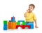 Little boy is playing with colorful building block