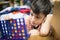 Little boy playing connect four game soft focus at eye contact