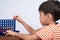 Little boy playing connect four game soft focus at eye contact indoor activities