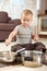 Little boy playing with cooking pots