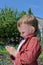 Little boy playing with an insect