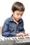 Little boy playing keyboard