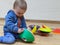 Little boy playing with marker cones