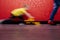 Little boy is playing with model bulldozer in a public place. Motion blur