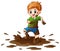 Little boy playing in the mud