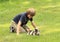 Little boy playing with a puppy