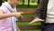 Little boy playing rock-paper-scissors with his grandfather and winning banana