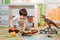 Little boy playing toy cars on play mat. Young kid with colorful educational vehicle and transport toys on carpet. City street map