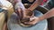 A little boy in a pottery class. Shot on a phone