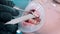 A little boy in protective glasses with baby teeth having a teeth cleaning treatment in the dentistry - collect the