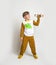 Little boy in pyjamas with wood toy plane. Yawning blond kid in pyjamas with dinosaur animals pattern and map print