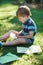 Little boy reading letter from friend