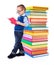 Little boy reading near big stack of books