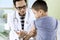 Little boy receiving vaccine injection