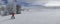 Little boy in a red jacket, skiing in a winter resort in the Pyrenees with empty slopes, panoramic format