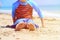 Little boy relax at summer beach, focus on feet