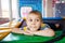 Little boy resting on trampoline in play centre