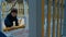 Little boy rides down a plastic slide on the playground in cool day.