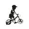 Little boy riding balance bike, side view isolated vector silhouette, no pedal bike, ink drawing