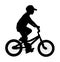 Little boy riding bicycle vector silhouette illustration isolated on white background. Kid enjoying in bike drive. Child active.