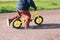 Little boy riding Puky balance bike