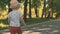 Little boy running outside. Slow motion of child running in park