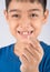 Little boy showing baby teeth toothless close up waiting for new teeth