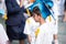 Little boy showing graduated hat uniform at kindergarten school