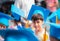 Little boy showing graduated hhat uniform at kindergarten school