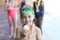 Little boy showing medal at poolside