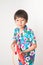 Little boy sibling boy in Thai flower dress tradition for Thai new year
