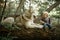 Little boy sits on tree trunk next to lying dog malamute.