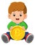 The little boy is sitting and playing with the one big bitcoin