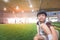 Little boy sitting in soccer training field