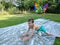 A little boy sliding down a slip and slide