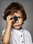 Little boy with a small photographic camera