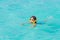 Little boy snorkeling in the ocean