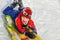 Little Boy with Spiderman Hat Sledding in Snow