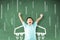 little boy standing against chalkboard and airplane  icon on the board