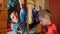 Little Boy In The Suit Of Superman Looks At The Image Of Favorite Character On Poster And Repeats It Imitates Him