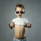 Little boy in sunglasses. funny child show belly
