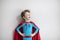 Little boy superhero with red cape. Happy smiling child. Success, motivation