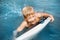 Little boy with surfboard having fun. Vacation, summer and childhood concept