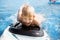 Little boy with surfboard having fun. Vacation, summer and childhood concept