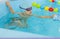 Little boy swimming in pool, kid in glass learning swim by crawls . Sport and hardening. Healthy mind. children`s